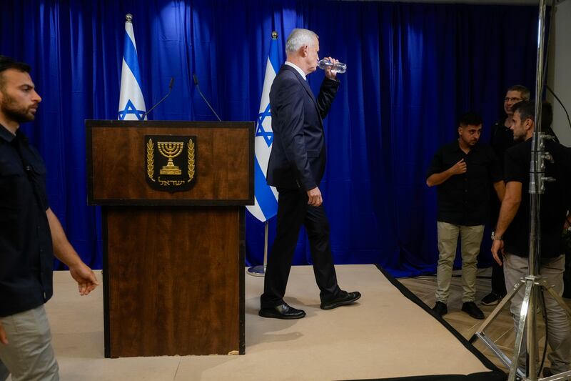 Benny Gantz, a centrist member of Israel’s three-member war cabinet, drinks as he leaves after announcing his resignation in Ramat Gan, Israel (Ohad Zwigenberg/AP)