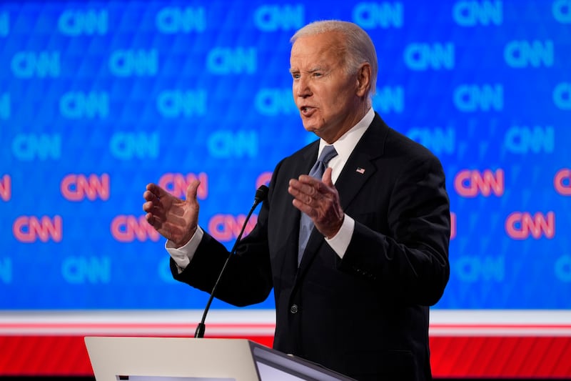 Mr Biden had issues with his voice throughout the debate (Gerald Herbert/AP)