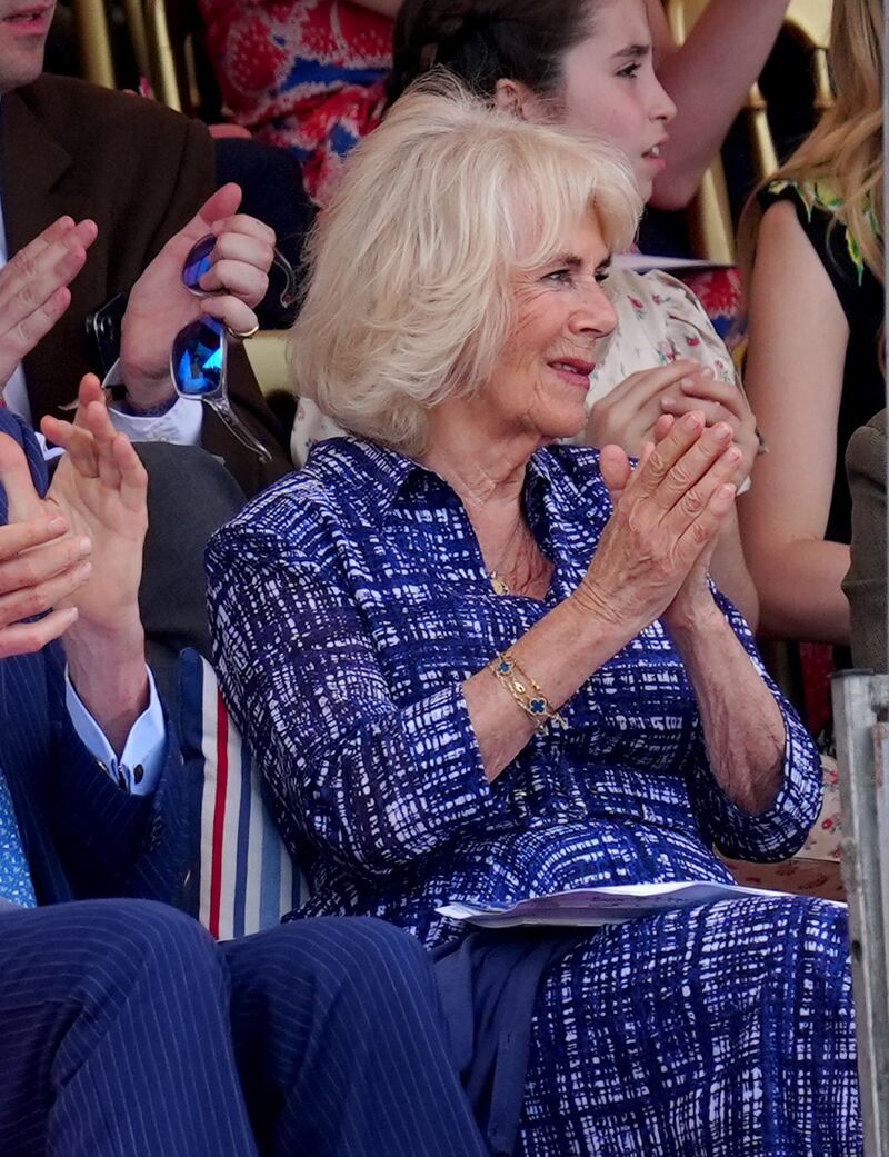 Camilla applauds while watching from the grandstand