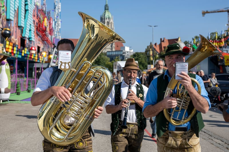 A brass band plays during a press tour at the Oktoberfest, in Munich, Germany (Lennart Preiss/dpa via AP)