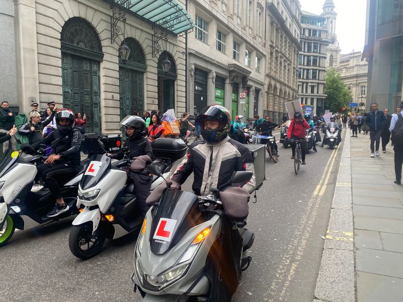 Deliveroo drivers stage a motorcade protest after the company’s AGM.