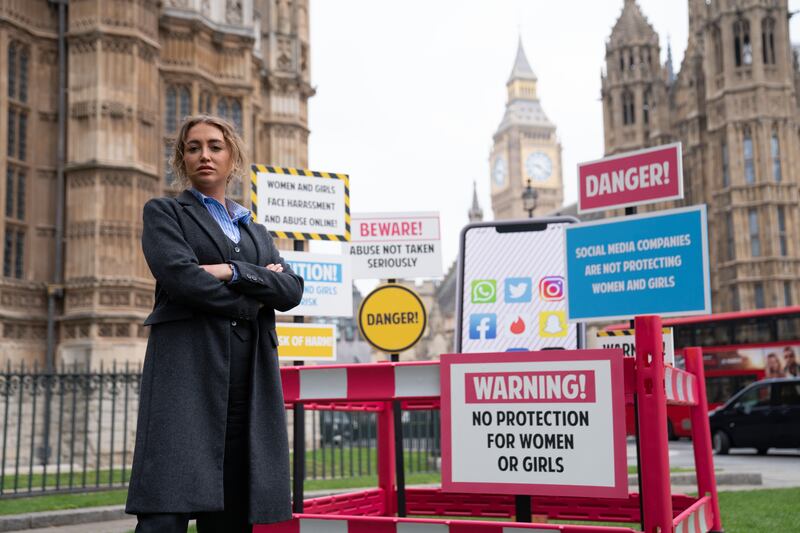 Georgia Harrison, who was a victim of revenge porn, at a demonstration organised by Refuge outside the Houses of Parliament, Westminster