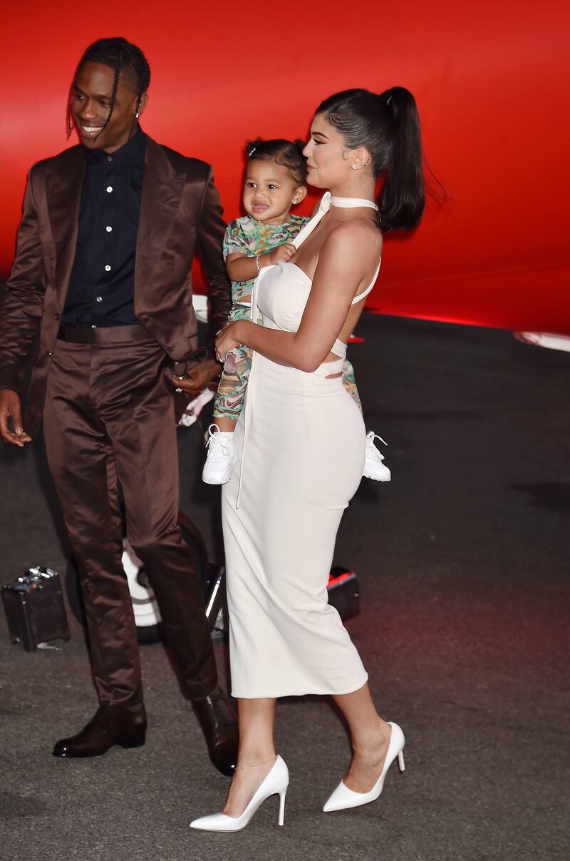 Travis Scott, Stormi Webster and Kylie Jenner attend the Travis Scott: “Look Mom I Can Fly” Los Angeles Premiere at The Barker Hanger in 2019