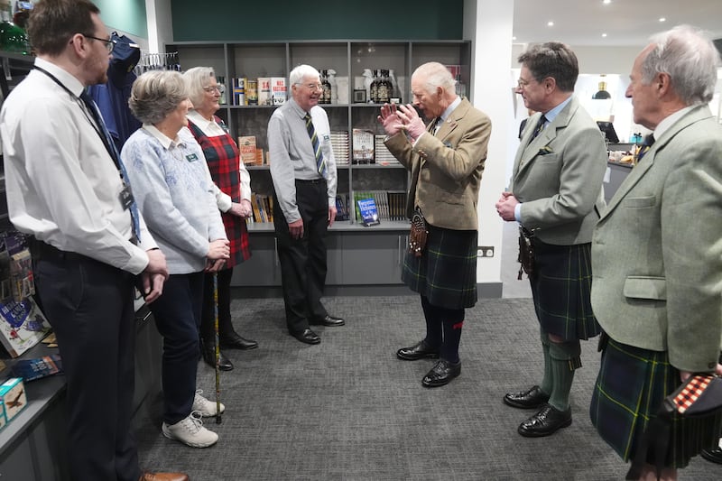 Charles meets staff at the museum during his visit