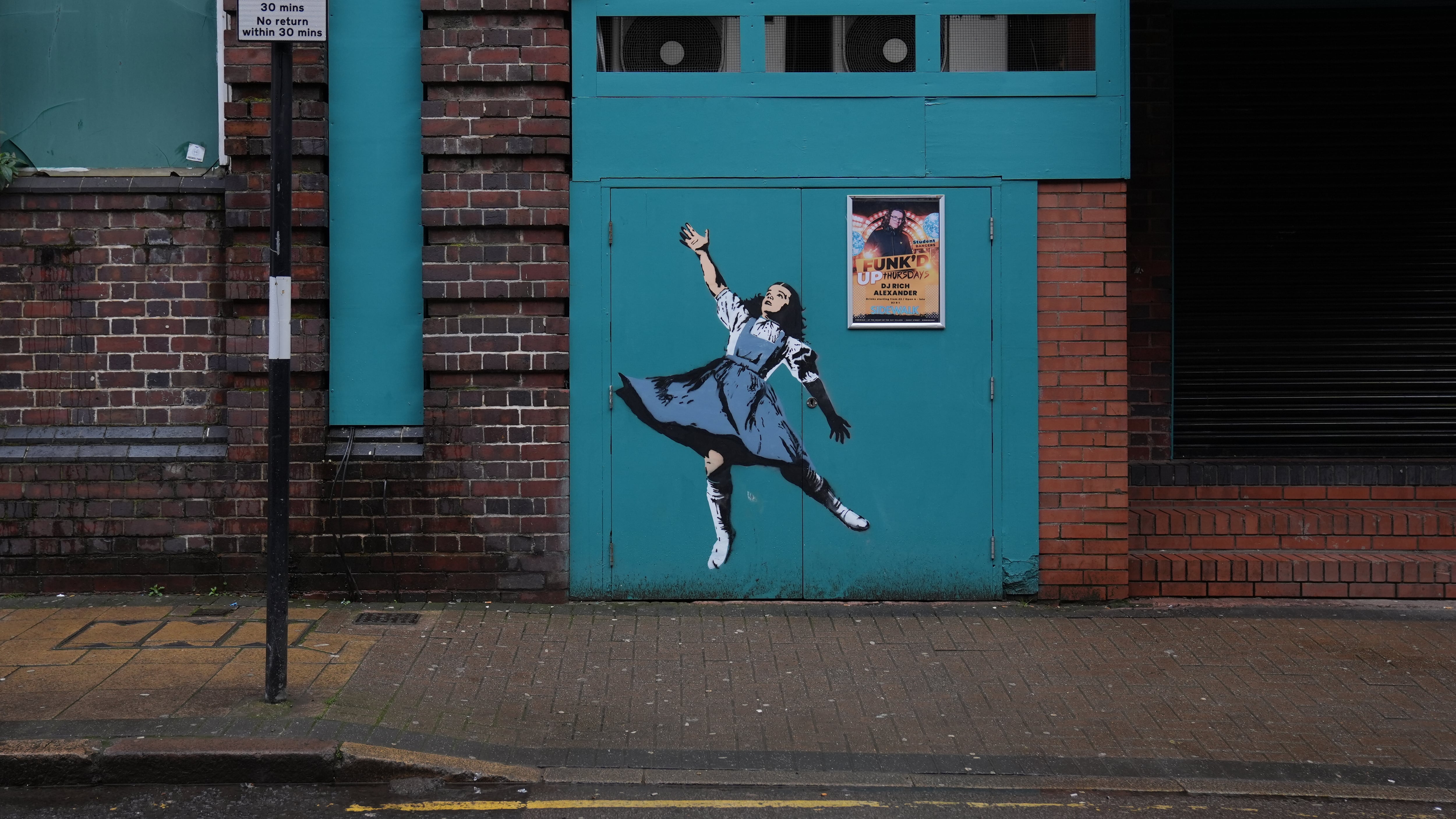 A mural depicting Dorothy from The Wizard Of Oz, on the side of Sidewalk bar on Kent Street in Birmingham
