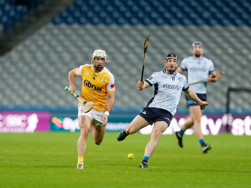 Antrim's Paddy Burke chases a ball with Dublin's Cian O' Sullivan in Saturday's Allianz National Hurling League Division 1B opener at Croke Park Picture: Dylan McIlwaine