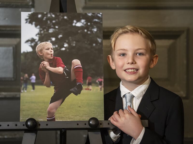 Mateo Robayna with a photograph of himself taken by his sister