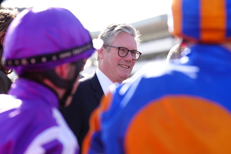 Sir Keir Starmer speaks to the jockeys ahead of the Betfred St Leger Stakes