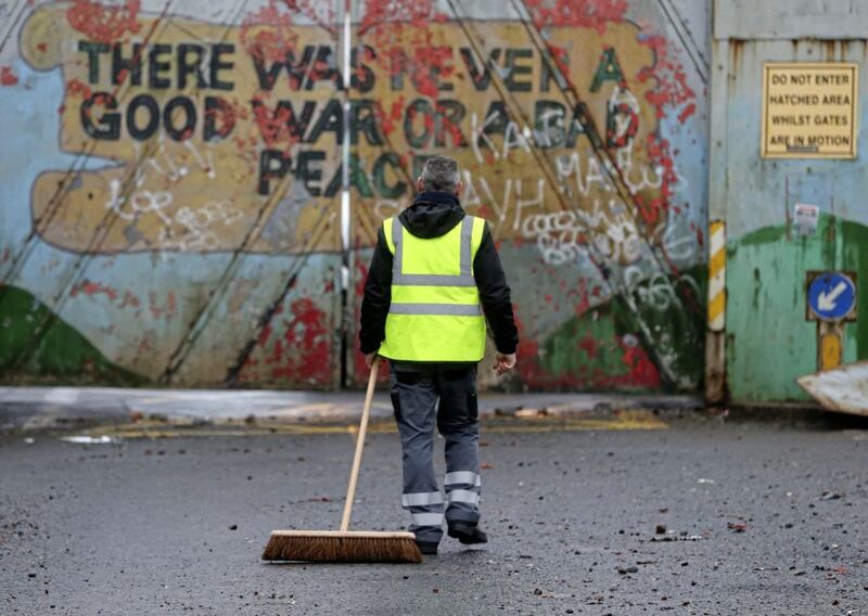 &nbsp;The clean up begins at the peace gates in Lanark Way in west Belfast after a night of rioting. Picture by Mal McCann