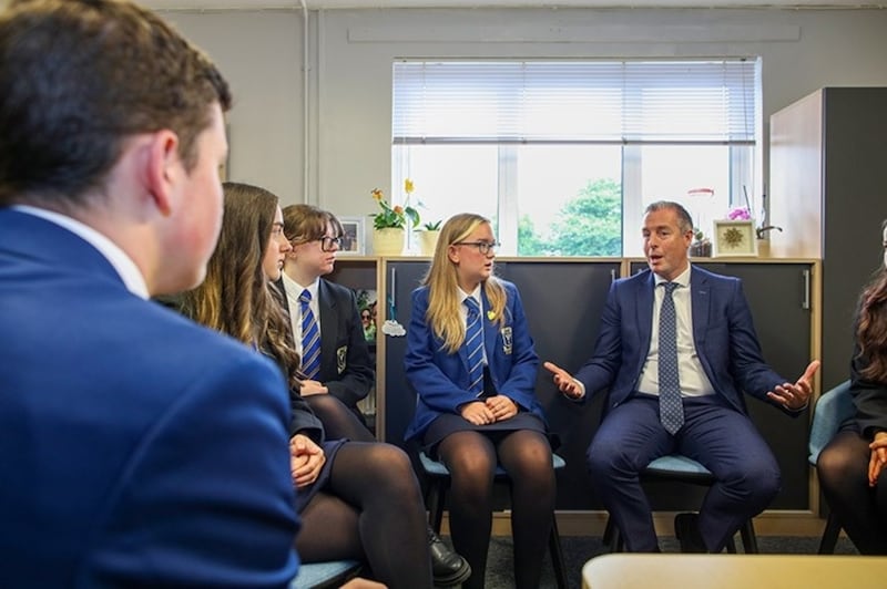 Education minister Paul Givan with pupils at St Columbanus College, Bangor