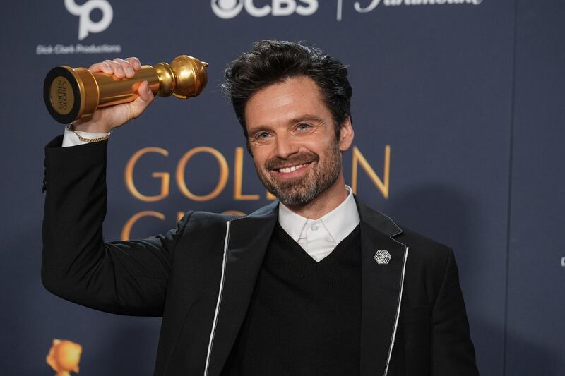 Sebastian Stan poses in the press room with the award or A Different Man (Chris Pizzello/AP)