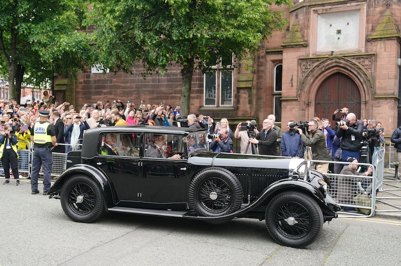 Olivia Henson arrives in a vintage car for her wedding to Hugh Grosvenor, the Duke of Westminster, at Chester Cathedral