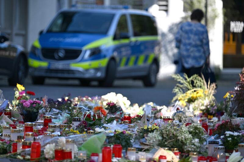 Flowers and candles are laid near the scene of a deadly knife attack during a festival, in Solingen, Germany (Federico Gambarini/AP)