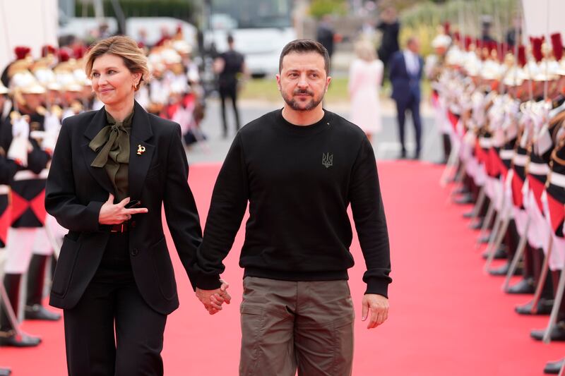 Ukrainian President Volodymyr Zelensky and his wife Olena Zelenska arrive at the international ceremony at Omaha Beach in Normandy (Virginia Mayo/AP)