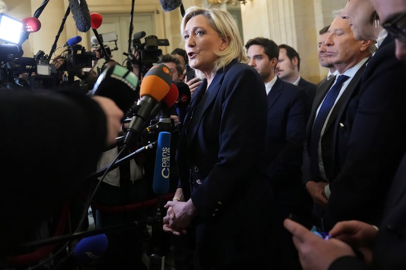 French far-right leader Marine Le Pen has announced that her National Rally party will file a motion of no confidence in the prime minister (Michel Euler/AP)