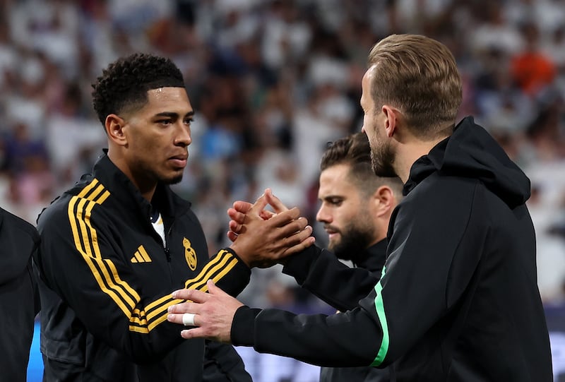 Real Madrid’s Jude Bellingham, left, and Harry Kane of Bayern Munich before kick-off at the Santiago Bernabeu