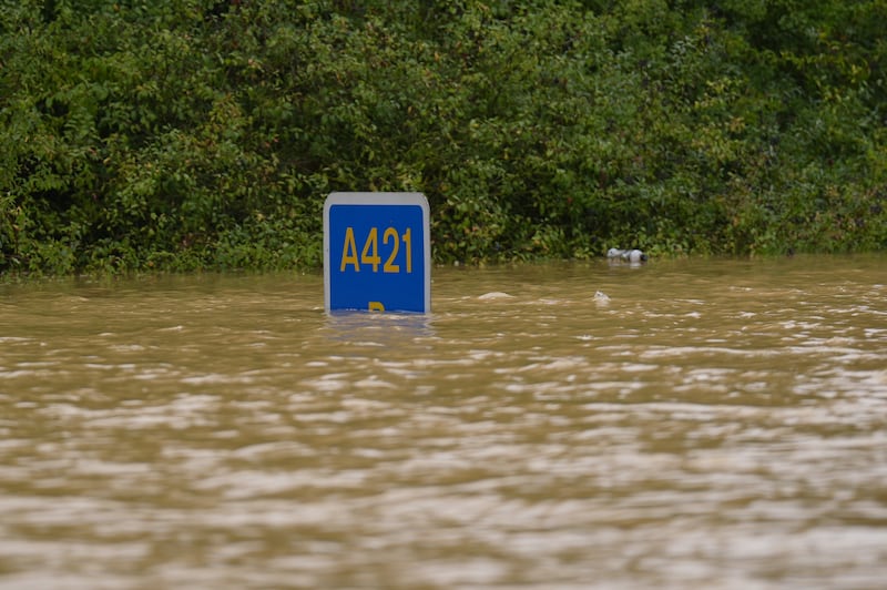 A road sign submerged in flood water on the A421 in Marston Moretaine, Bedfordshire