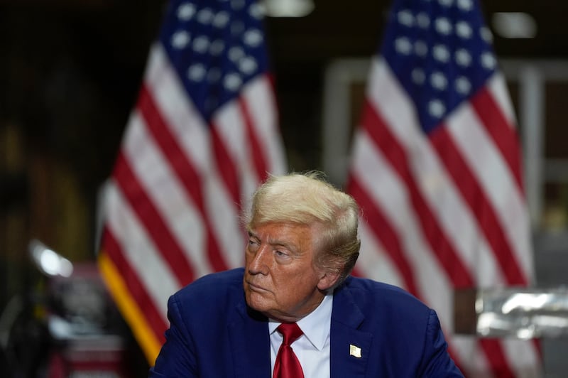 Donald Trump listens at a business roundtable discussion at a campaign event at Precision Components Group (Julia Nikhinson/AP)