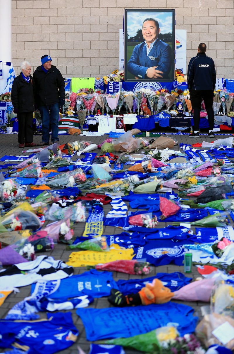 Tributes and an image of Leicester City Football Club Chairman, Vichai Srivaddhanaprabha outside the King Power Stadium in 2018