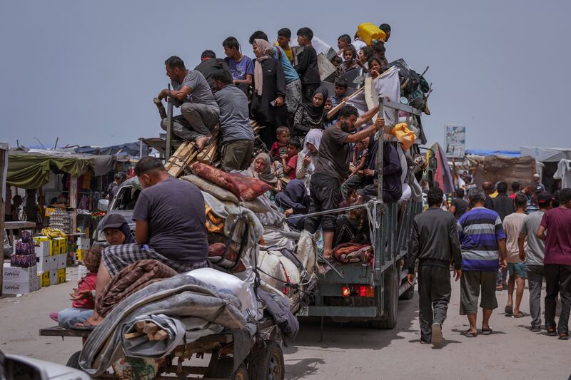 Palestinians fleeing from the southern Gaza city of Rafah during an Israeli ground and air offensive in the city (Abdel Kareem Hana/AP)