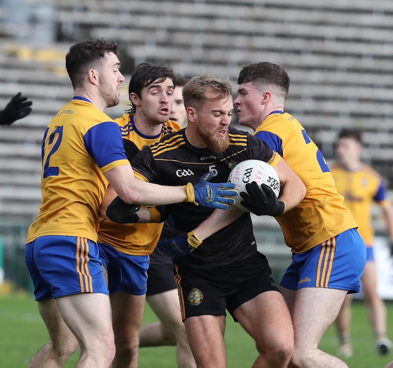 Ultan Kelm (centre) of Erne Gaels proved too powerful for Enniskillen Gaels.