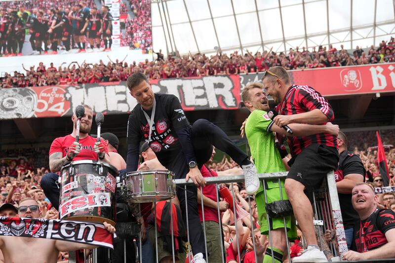 Xabi Alonso (centre) hailed the togetherness from his players and fans (Martin Meissner/AP)