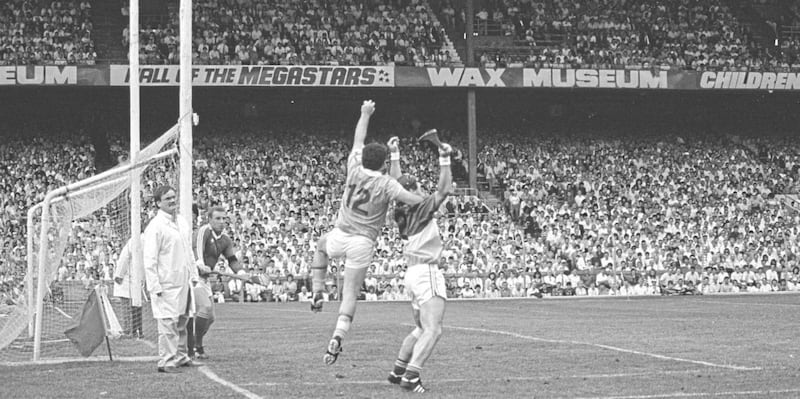 Despite standing just 5&#39;6, Antrim&#39;s Olcan McFetridge soars above 5&#39;10 Offaly corner-back Aidan Fogarty before being felled by Faithful &#39;keeper Jim Troy. Referee Terence Murray immediately signalled for a penalty, and Aidan McCarry made no mistake. Picture by Curly McIlwaine 