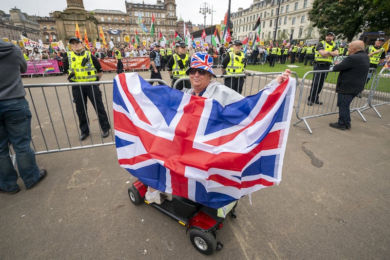 Supporters of a Pro-UK rally endorsed by Tommy Robinson gather in Glasgow’s George Square