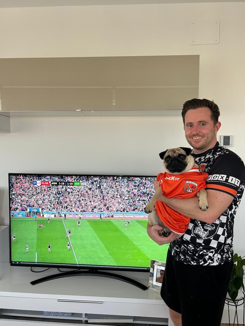 Armagh fan Paddy Sherry with Coco the Pug wearing the home side's colours