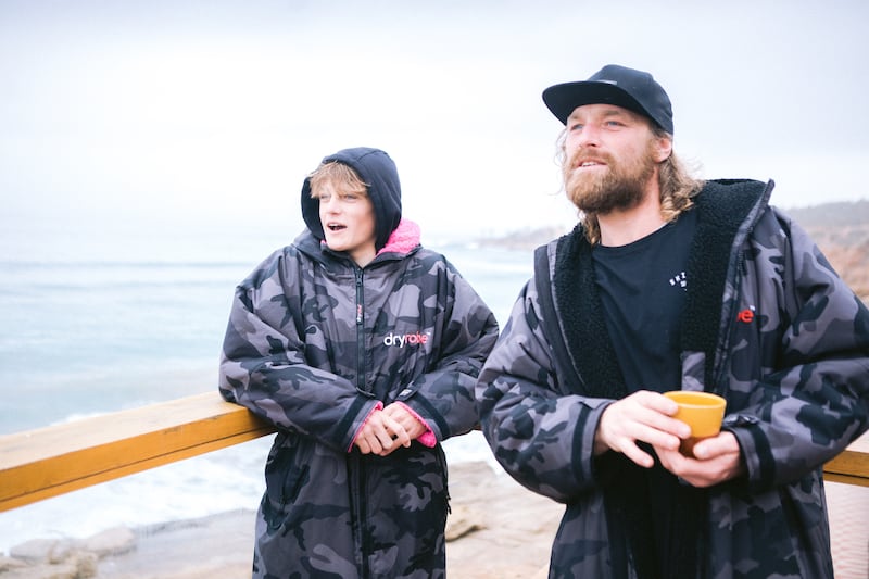 (from left to right) Lukas next to his father Ben, who are both surfers (dryrobe)