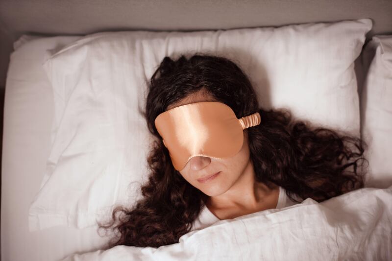 Propping yourself up with pillows and using silk can help reduce puffy eyes in the morning