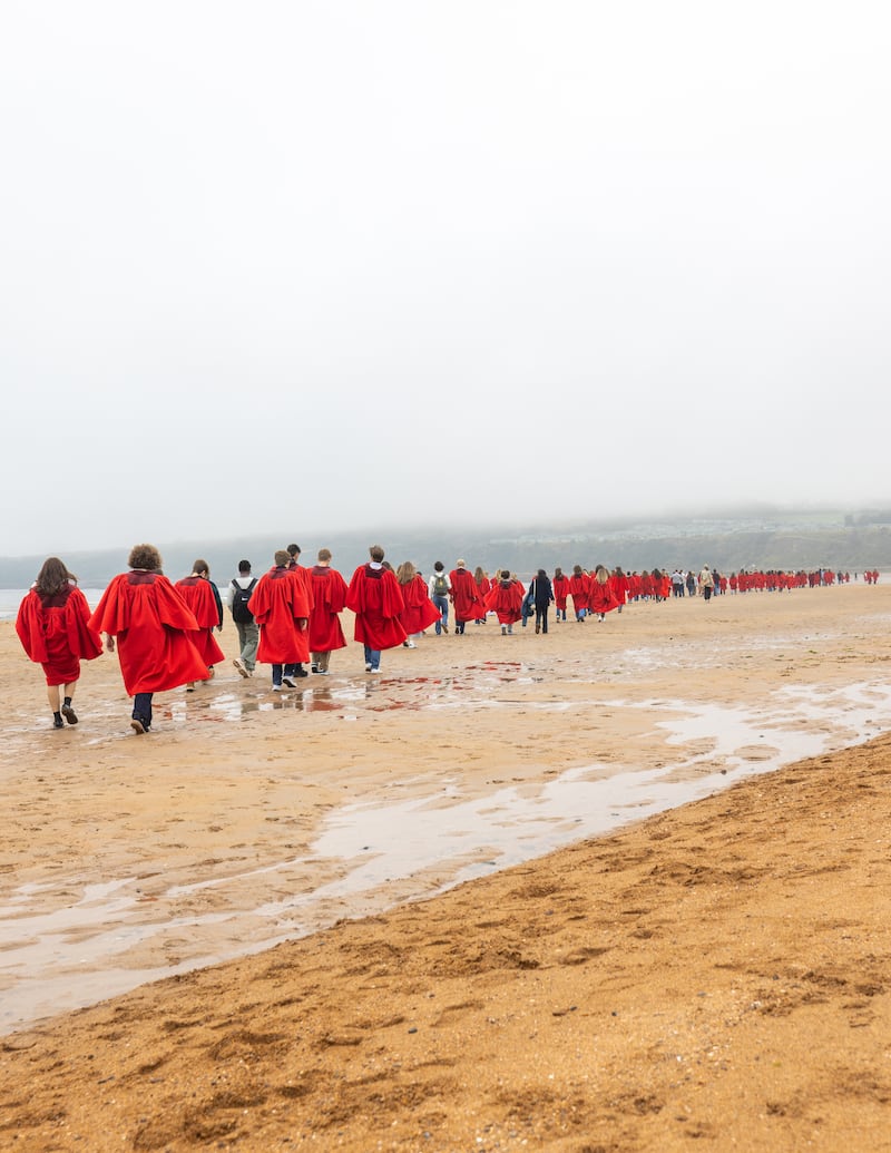 Undergraduates at the University of St Andrews take part in the traditional Pier Walk