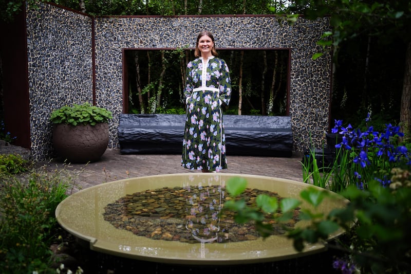 Ula Maria poses in her Forest Bathing Garden, at the RHS Chelsea Flower Show