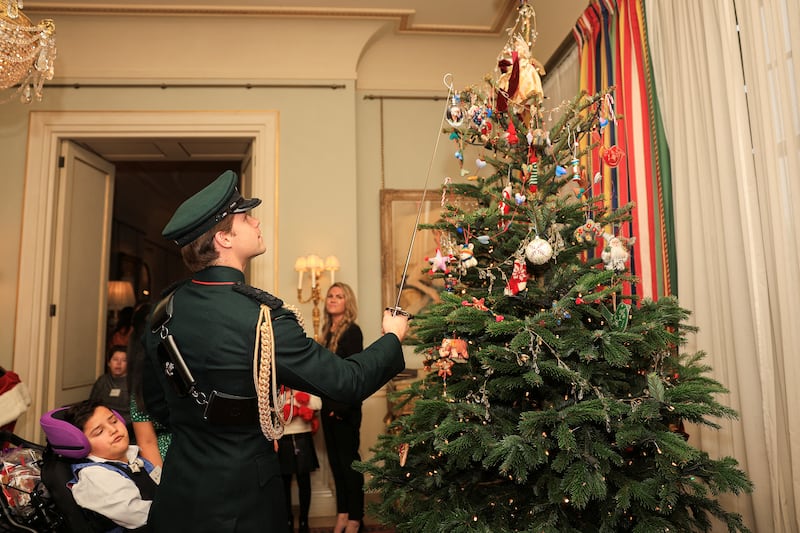 Major Ollie Plunket hung up decorations with a sword