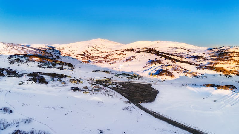 Sunrise over Perisher valley ski resort town in Snowy Mountains of Australia