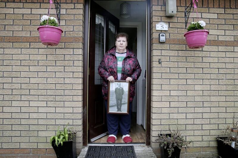 Alice Harper (n&eacute;e Teggart) at her home in west Belfast with a picture of her father Daniel Teggart. Picture by Hugh Russell