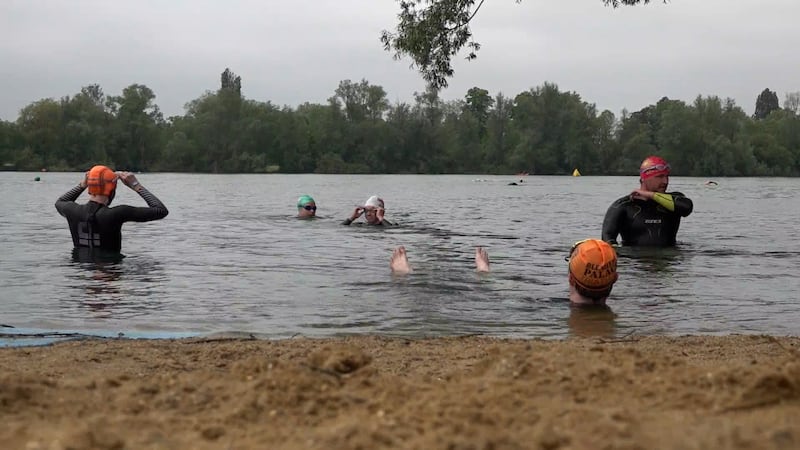 Swimmers at Shepperton Open Water Swim, a swimming spot at Ferris Meadow Lake in Surrey