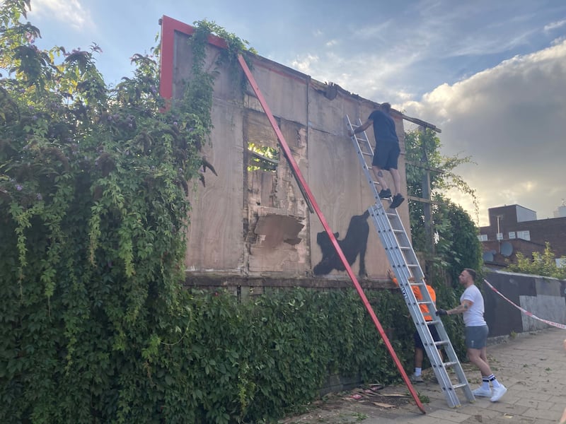 Contractors dismantled the billboard in Cricklewood, north-west London, with a Banksy artwork of a stretching ‘for safety reasons’