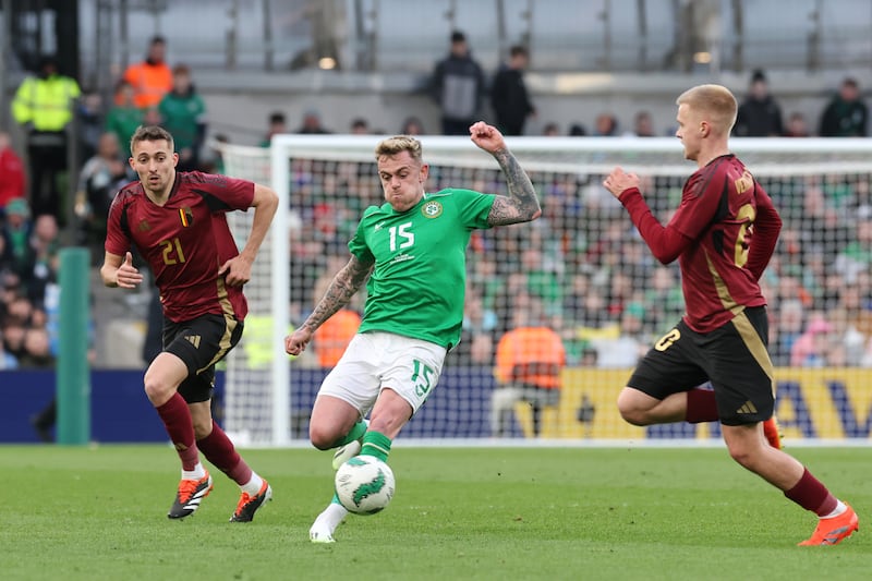 Republic of Ireland’s Sammie Szmodics, centre, in action with Belgium’s Timothy Castagne, left, and Arthur Vermeeren