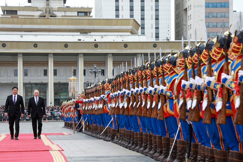 Russian President Vladimir Putin and Mongolian President Ukhnaagiin Khurelsukh attend a welcome ceremony in Sukhbaatar Square in Ulaanbaatar, Mongolia (Vyacheslav Prokofyev, Sputnik, Kremlin Pool Photo via AP)