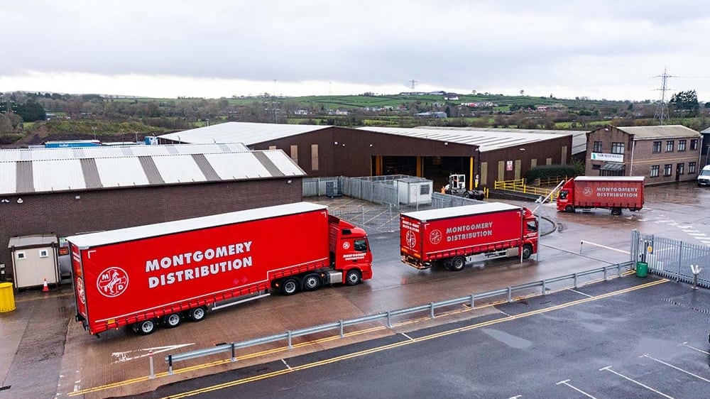 Red Montgomery Transport lorries and trailers parked at the group's Ballyearl hub in Co Antrim.
