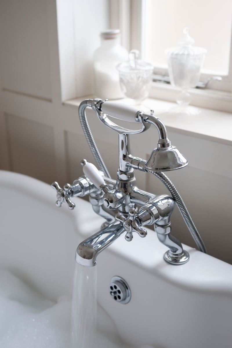 Photo of a bath tap running