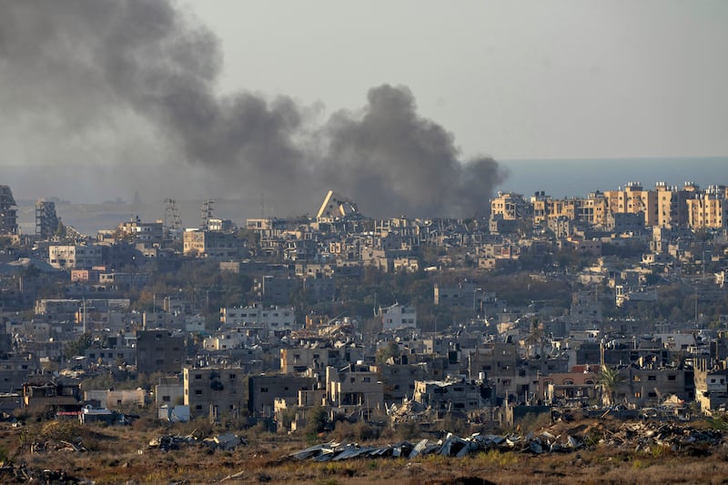 Smoke rises following an explosion in the Gaza Strip (Ohad Zwigenberg/AP)