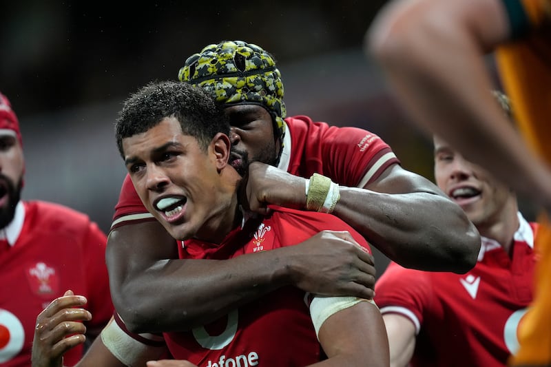 Wales’ Rio Dyer, left, celebrates with team-mate Christ Tshiunza after scoring a try (Asanka Brendon Ratnayake/AP)