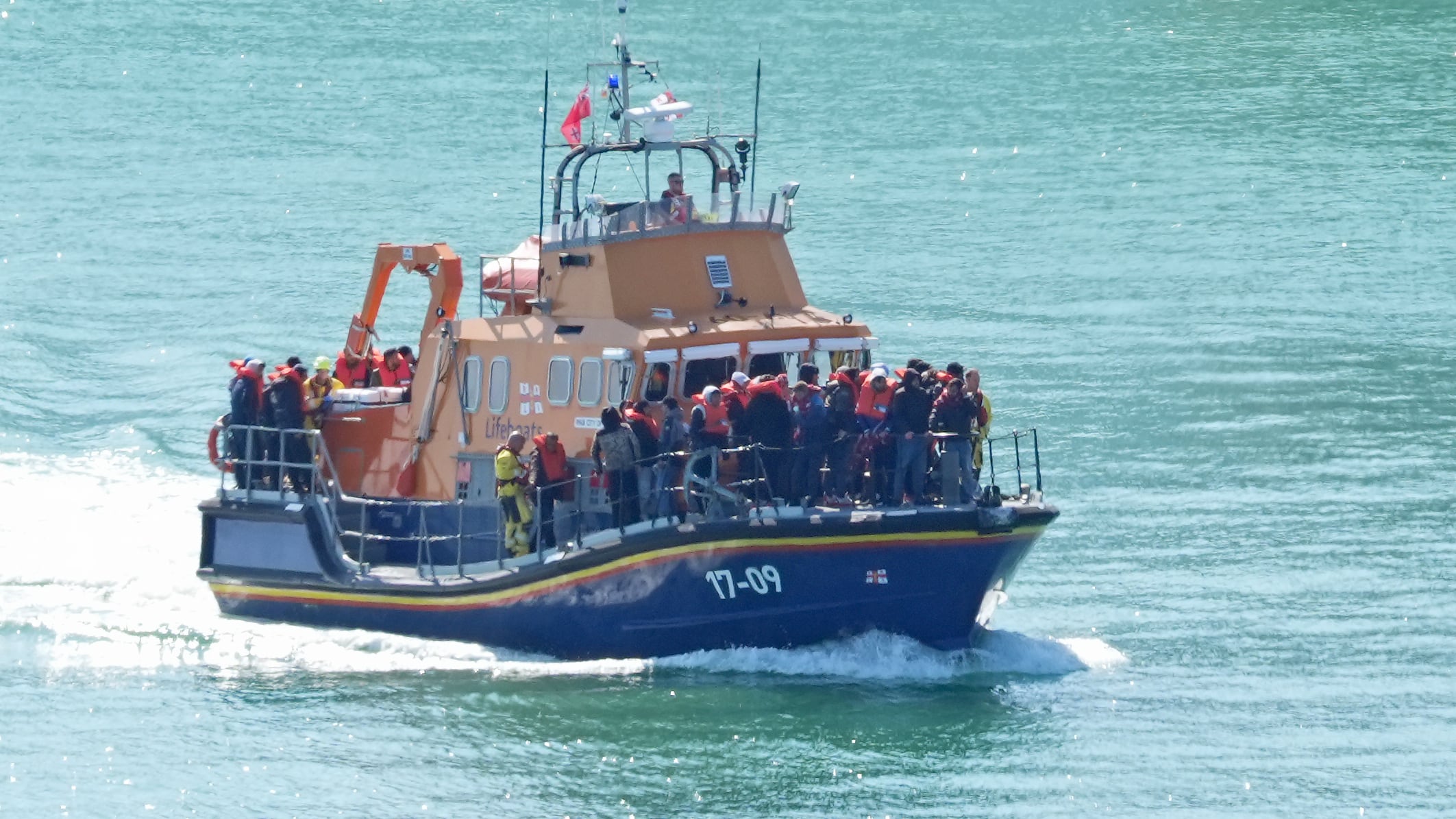 A group of people thought to be migrants are brought in to Dover, Kent, onboard the RNLI Dover Lifeboat