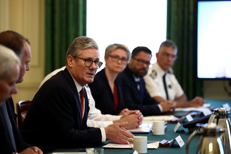 Sir Keir Starmer speaks with senior policing leaders during a meeting in Downing Street