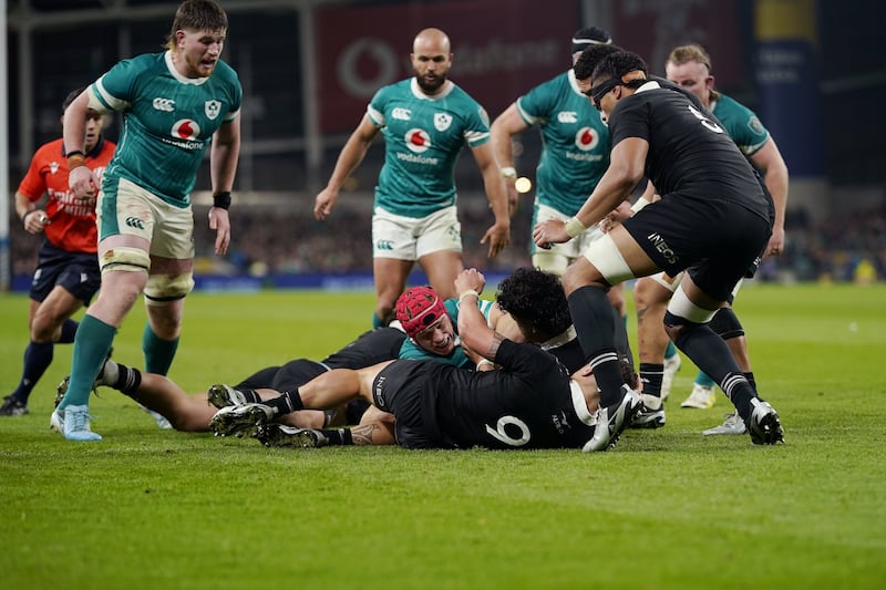 Josh van der Flier, centre, scores Ireland’s try against New Zealand