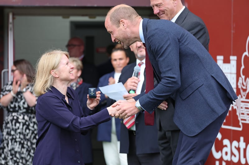 William presents a brooch to a former player from the WRU’s Missing Caps campaign, which aims to recognise players who were historically missed when they played for Wales