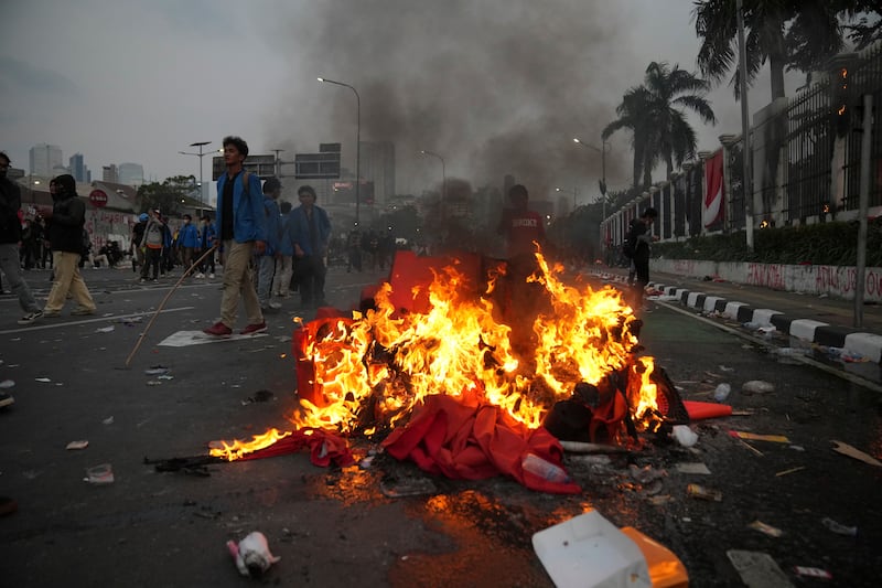 Indonesians are protesting against changes to election laws that could further enhance the political influence of Joko Widodo (AP Photo/Dita Alangkara)