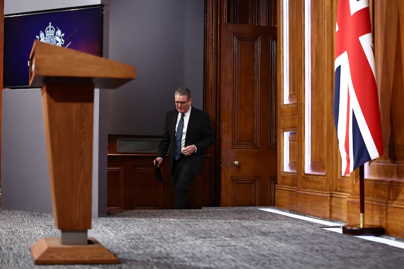 The carpet on the podium and the panels around the TV screen have been replaced with politically neutral grey